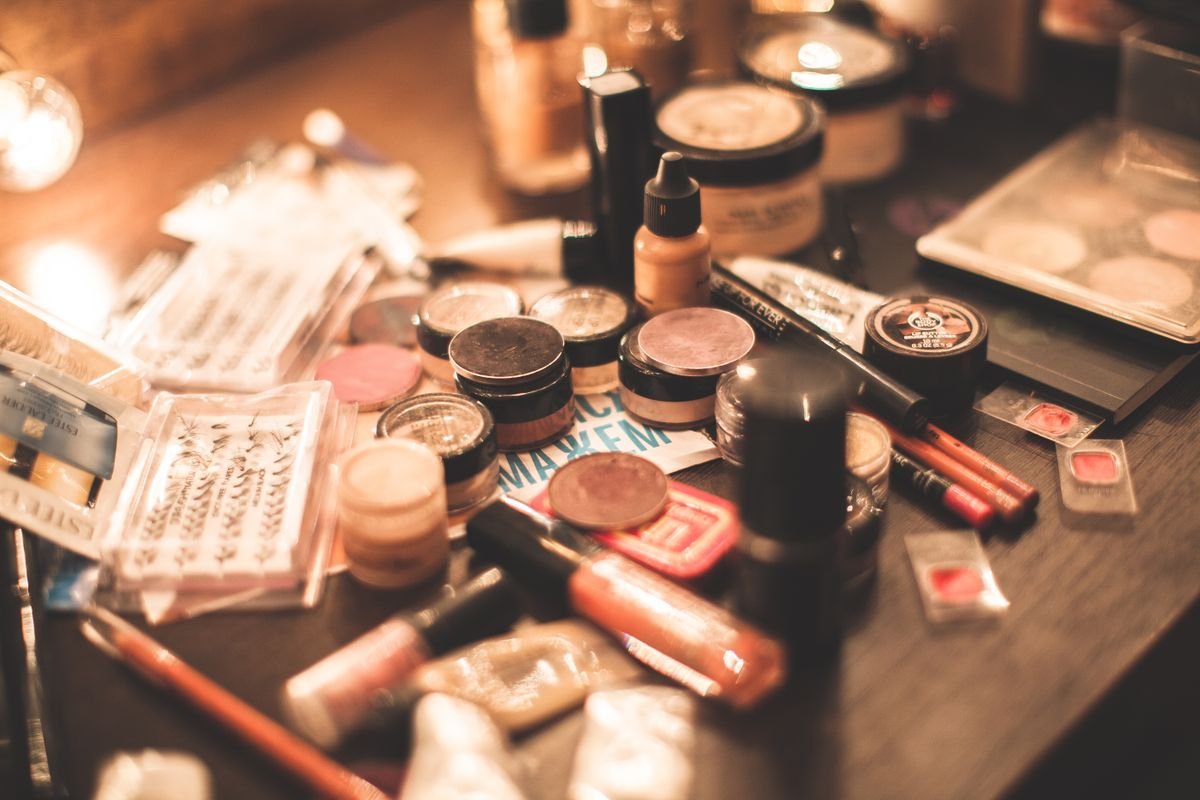 Cosmetics and small containers arranged on a dressing table